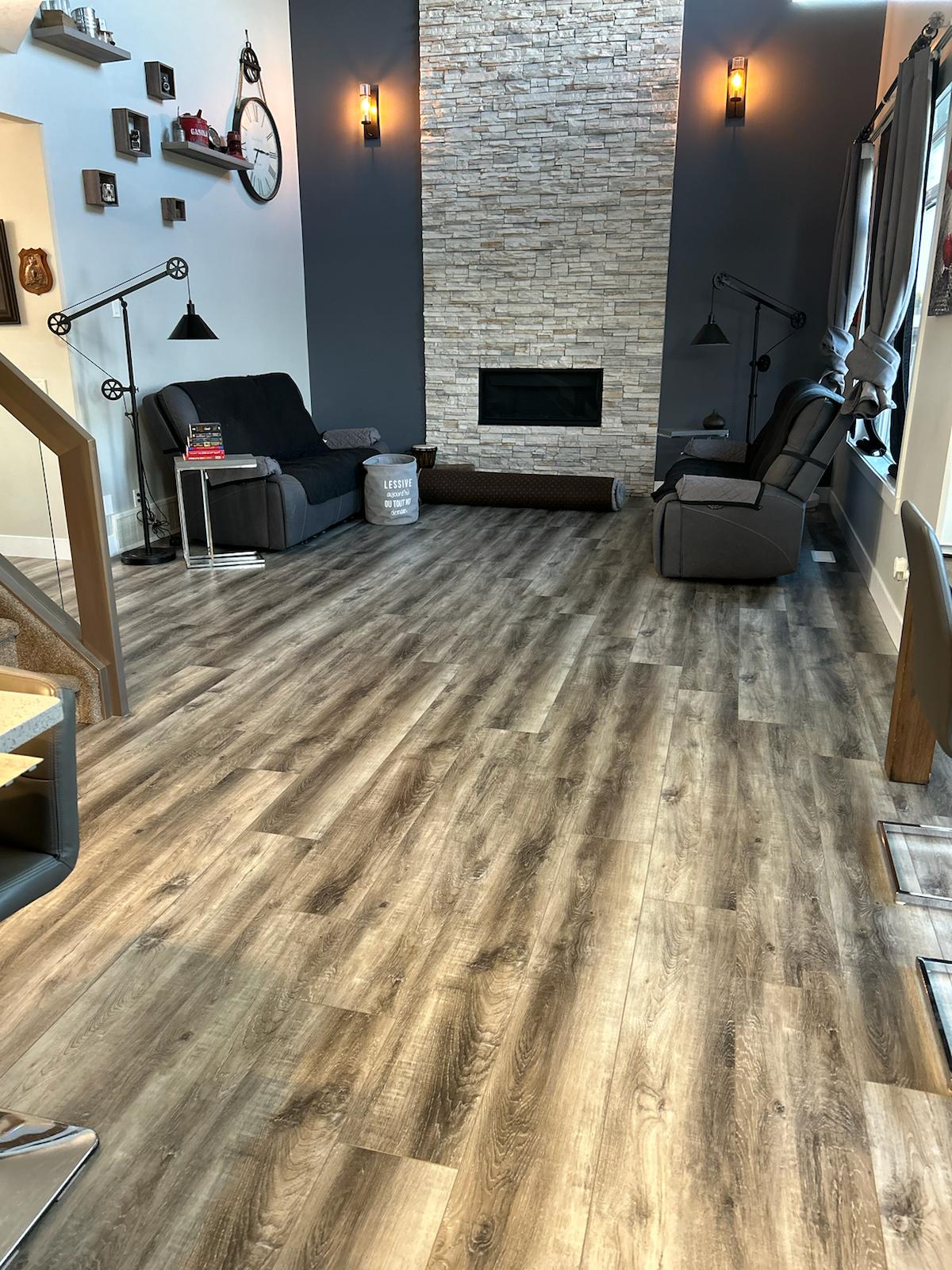 This beautiful Spruce Grove home boasts a luxurious 9" wide plank vinyl floor, creating a warm and aesthetically pleasing atmosphere.